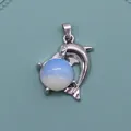 Silver dolphin pendant necklace with a round white opal stone in a minimalist design - Opal
