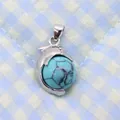 Silver dolphin-shaped pendant featuring a round blue turquoise stone bead - 14x23mm / Blue Turquoise