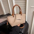 Sac seau en cuir grainé beige avec poignée nouée marron et design plissé chic - Khaki