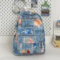 Mini denim backpack with floral embroidery and colorful fringe details in blue - No Pendant / Blue