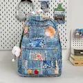 Mini denim backpack featuring floral embroidery and a white cloud plush pendant - With Cloud Pendant / Blue