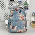 Mini blue denim backpack with colorful floral embroidery and white plush cloud charm - With Cloud Pendant / Light Blue