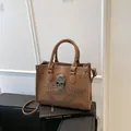Brown tote bag with silver skull motif and stud details on matte faux leather - Brown