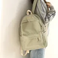 Minimalistischer hellgrüner wasserdichter Oxford-Rucksack mit großer Tasche und Lederlabel - Grün