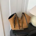 Brown quilted faux suede tote bag with golden chain straps and turn-lock closure - Brown