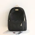 Black minimalist waterproof nylon backpack with cream handle and leather logo patch - Black
