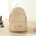 Minimalist beige waterproof Oxford cloth backpack with metal brand logo on front - Khaki