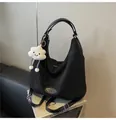 Detail of black suede hobo bag with fashion logo leather tag and fluffy cloud pendant - Black