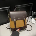 Mochila vintage en contraste de cuero marrón oscuro y canela con hebillas - Marrón