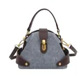Bolso de mano en denim y cuero marrón con detalles metálicos dorados elegantes - Azul