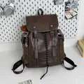 Vintage dark brown large capacity faux leather travel backpack with buckle straps - With Charm / Brown