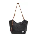 Fashionable black washed denim tote bag with brown braided rope handles and metallic tag - Black