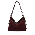 Retro burgundy suede tote bag with leather straps and gold buckles on white background - Red Velvet