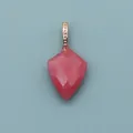 Macro view of geometric faceted pink natural stone pendant with gold bead bail detail - Pink Chalcedony