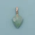 Close-up of faceted shield-shaped green natural stone pendant with golden beaded bail - Green Aventurine