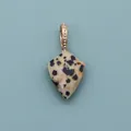 Detail of shield-shaped dalmatian jasper stone pendant with gold beaded texture bail - Dalmatian Jasper
