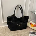 Minimalist black faux suede tote bag with leather handles and golden metal buckles - Black