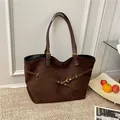 Large dark brown suede tote bag with golden metal buckle and adjustable straps - Brown