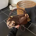 Vintage dark brown barrel handbag with glossy finish and leopard plush heart charm - Coffee PU With Charm