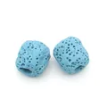 Macro shot of light blue cylindrical volcanic lava stone beads for DIY jewelry making - Light Blue