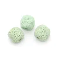 Macro detail of three light green porous volcanic stone cylinder beads for DIY jewelry - Pale Green