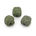 Macro shot of three dark green cubic lava stones with porous texture for DIY jewelry - Dark Green
