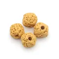 Macro detail of four yellow porous volcanic lava beads for DIY jewelry making accessories - No. 2 (Yellow)
