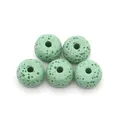 Macro shot of five light green lava stone beads with natural porous texture for DIY jewelry - Style 1 (Pale Green)