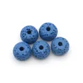Macro detail of five blue porous volcanic lava rock beads for DIY jewelry making - Style 3 (Blue)
