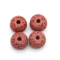 Close-up of four reddish-brown volcanic lava stone beads with porous texture for DIY jewelry - Style 10 (Reddish Brown)