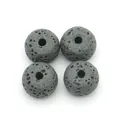 Close-up of four black lava stone rondelle beads with porous texture for DIY jewelry - Style 9 (Dark Gray)