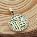 Detailed macro view of a gold Fu pendant with shell texture and sparkling crystal border - Abalone Shell