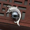 Macro view of silver dolphin pendant with pavé crystals and dark grey pearl inlay - Black Pearl Dolphin Shape (1014-B250606028)