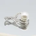 Macro view of silver flower pendant with large white pearl and pave set zirconia crystals - White Pearl Waterdrop Style (1014-B250606028)