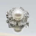 Macro shot of silver flower pendant with pearl and sparkling zircon stone details - White Pearl Five-Petal Flower (1014-B250606028) / White