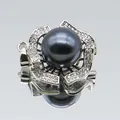 Macro shot of black pearl pendant with silver flower petals and micro-pave zircons - Black Pearl Five-Petal Flower (1014-B250606028) / Black