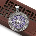 Close-up of silver-plated purple shell Tai Chi Bagua pendant on a wooden background - Medium Purple (No.4)