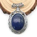 Detail of silver hollowed oval blue agate pendant with vintage engraving on wood base - 47x73mm / Lapis Lazuli