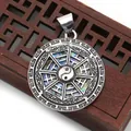 Polished Tai Chi shell pendant with Bagua symbols on a vintage wooden base - Abalone Shell (No. 6)