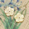 Macro view of flower shaped white mother of pearl shell beads with carved petal details - Yellow MOP Flower Shape (12x15mm)