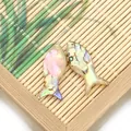 Set of two fish-shaped pendants made of natural abalone shell with colorful pearl luster - Camouflage Fish Shape