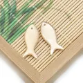 Pair of ivory fish-shaped natural shell pendants with pearlescent finish for DIY jewelry - Yellow Fish Shape
