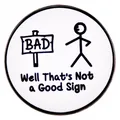 Round enamel pin featuring a funny stickman pointing at a Bad Sign on white background - Not A Good Sign