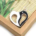 Minimalist heart-shaped magnetic couple pendant in black and white oil drip alloy finish - Stitching Heart Pendant (002) / 100 Pairs/Pack (28mm) / Black and White