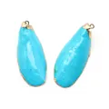 Lot de deux pendentifs en turquoise avec bordure dorée et anneau pour création DIY - Coquille de Paon Bleue
