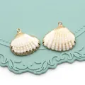 Lot de deux pendentifs coquillages bords dorés pour création bijoux artisanaux - Arche du Japon