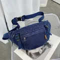 Deep blue denim chest bag for women with adjustable strap and multiple zip pockets - Dark Blue