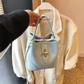 Light blue lychee texture leather bucket bag with elegant gold metal twist lock buckle - Blue