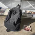 Retro-Rucksack aus gewaschenem Denim in Anthrazit mit Quasten-Reißverschlüssen - Schwarz