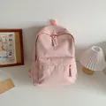 Pink minimalist nylon student backpack with woven zipper detail and adjustable straps - Pink